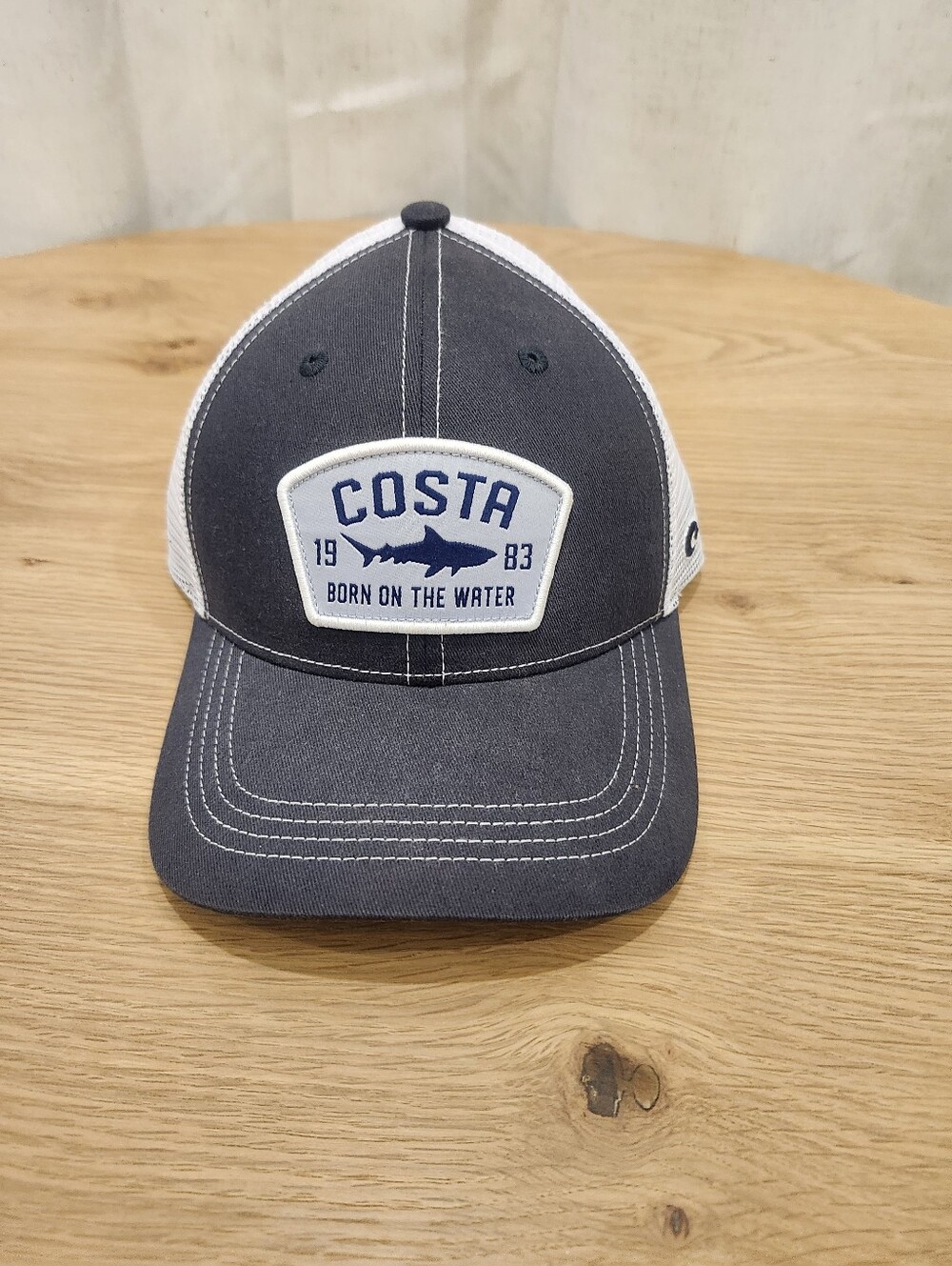 Costa Navy and White Trucker Hat with Embroidered Patch